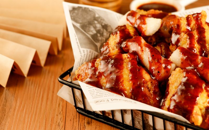 Wings over classic hand-battered chicken tenders golden fried