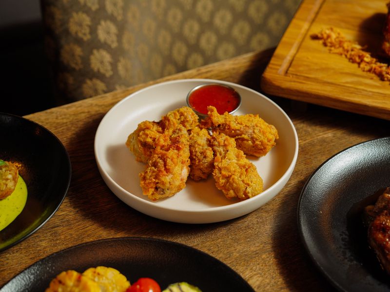 Wings over Classic Buffalo wings — crispy and saucy